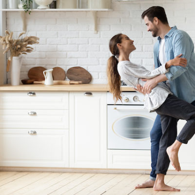 Relationship Coaching Services - Couple Dancing In Kitchen